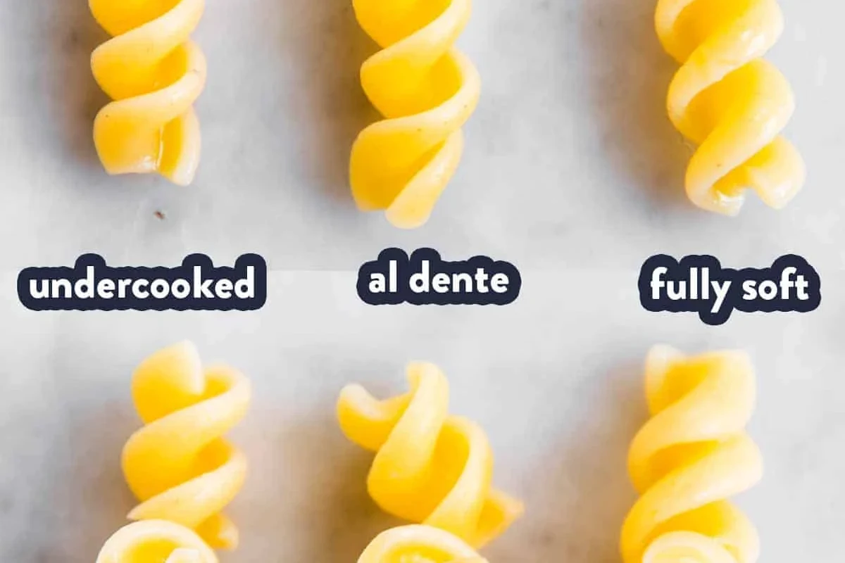Bowl of al dente pasta with sauce in a bright home kitchen