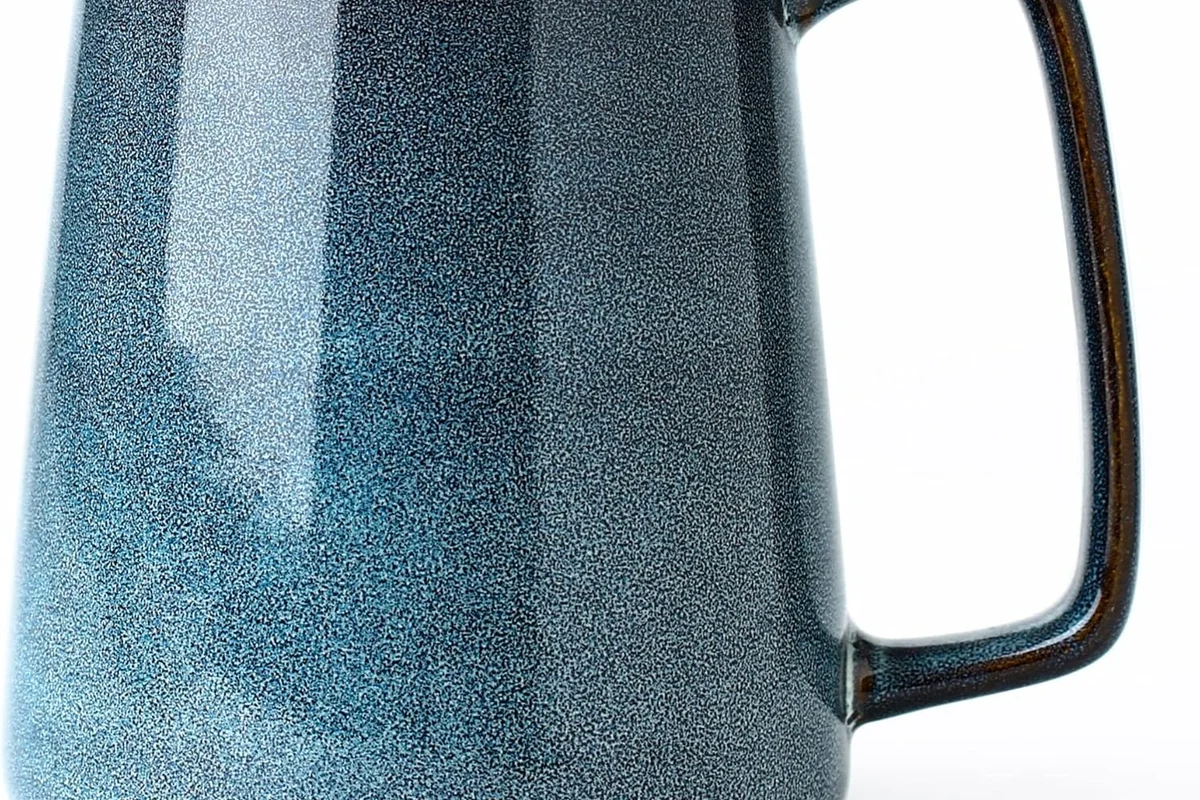 Coffee mugs in different sizes arranged on a kitchen counter for daily use