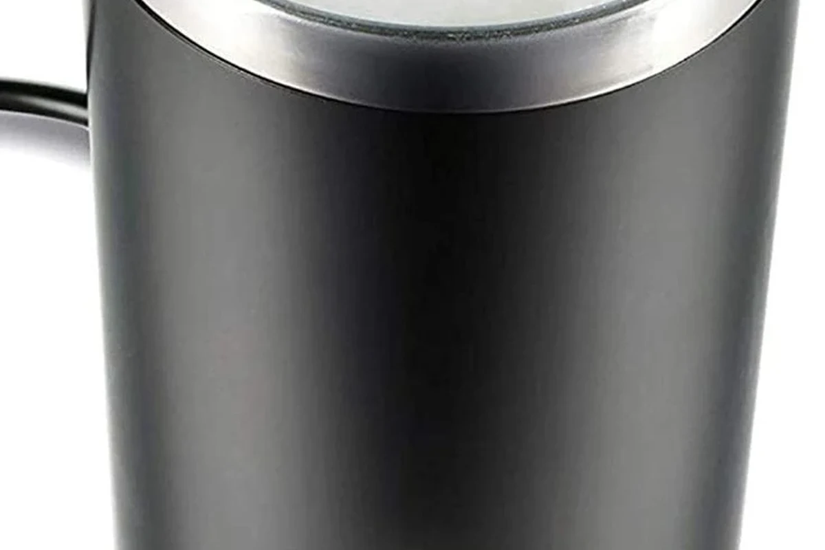 Bodum Bistro electric milk frother with warm milk foam in a small kitchen