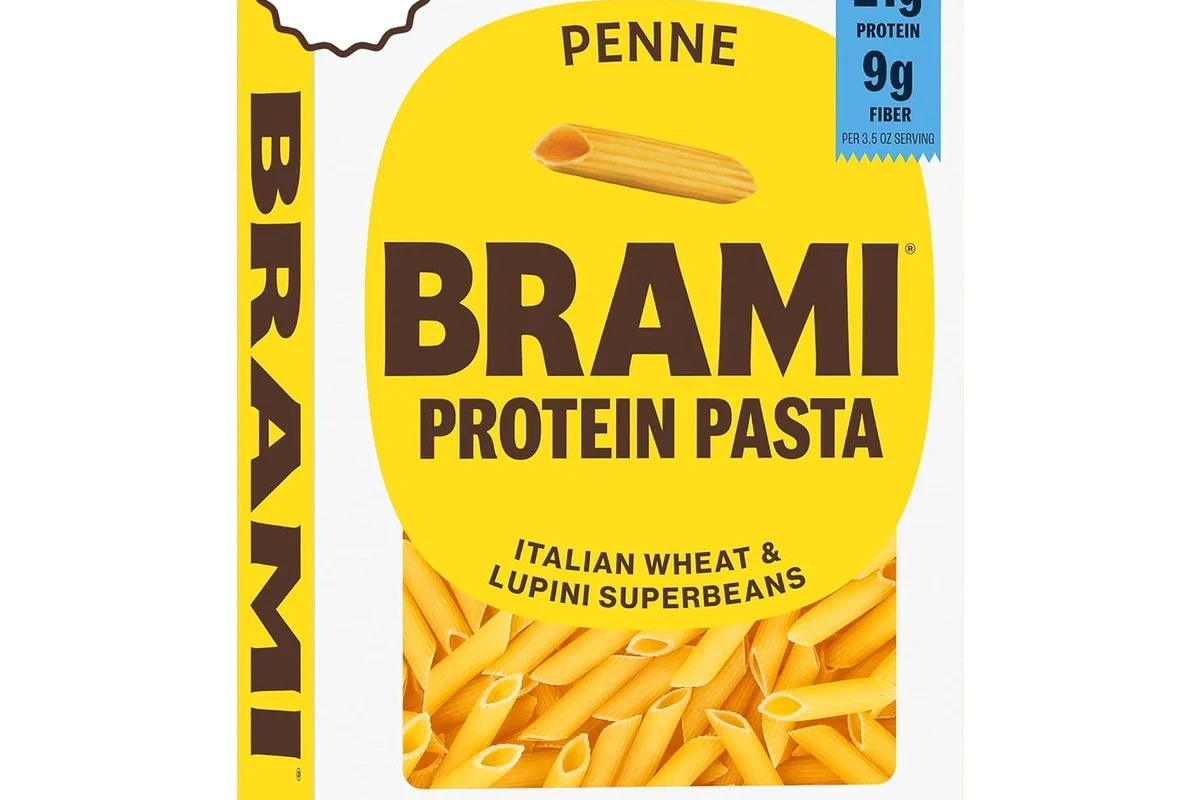 Bowl of Brami pasta with vegetables and light sauce on a kitchen table