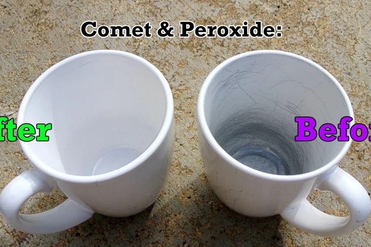 Scratched coffee mug beside mild soap, soft sponge, and baking soda on a kitchen counter