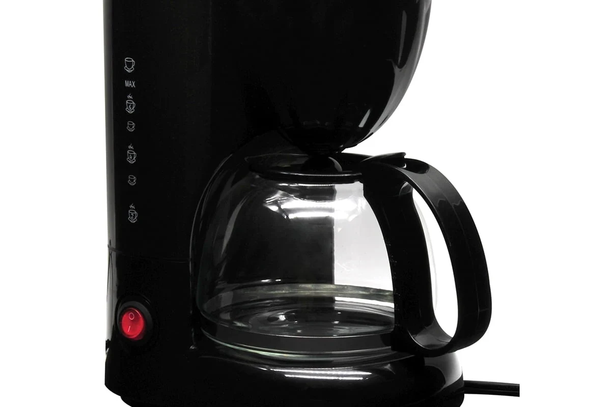 French press coffee brewing on a kitchen counter with a glass carafe and rich dark coffee