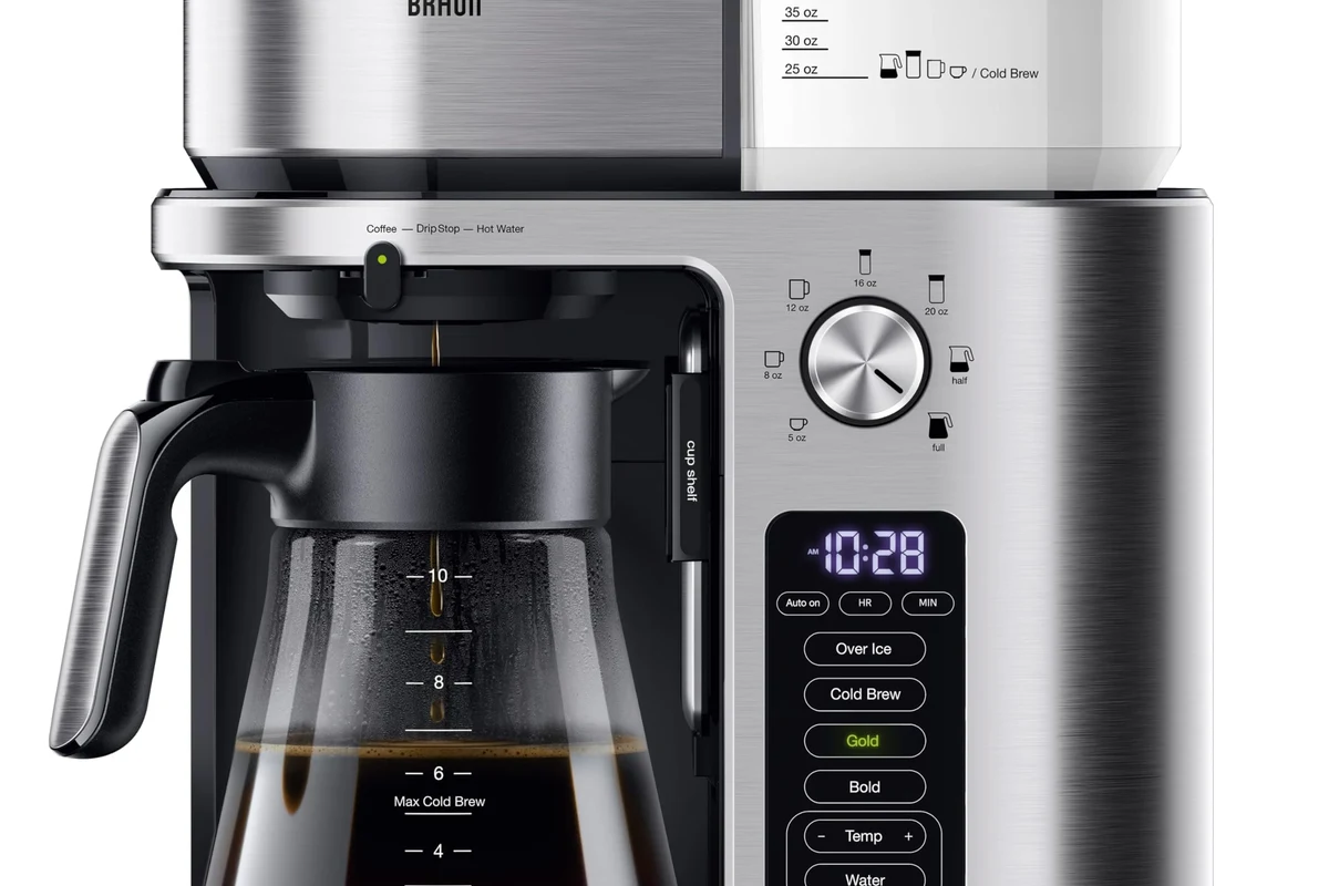 French press coffee maker with coarse grounds and hot coffee in a kitchen setting
