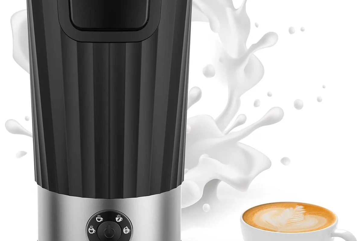 Electric milk frother with removable whisk and cleaning tools on a kitchen counter