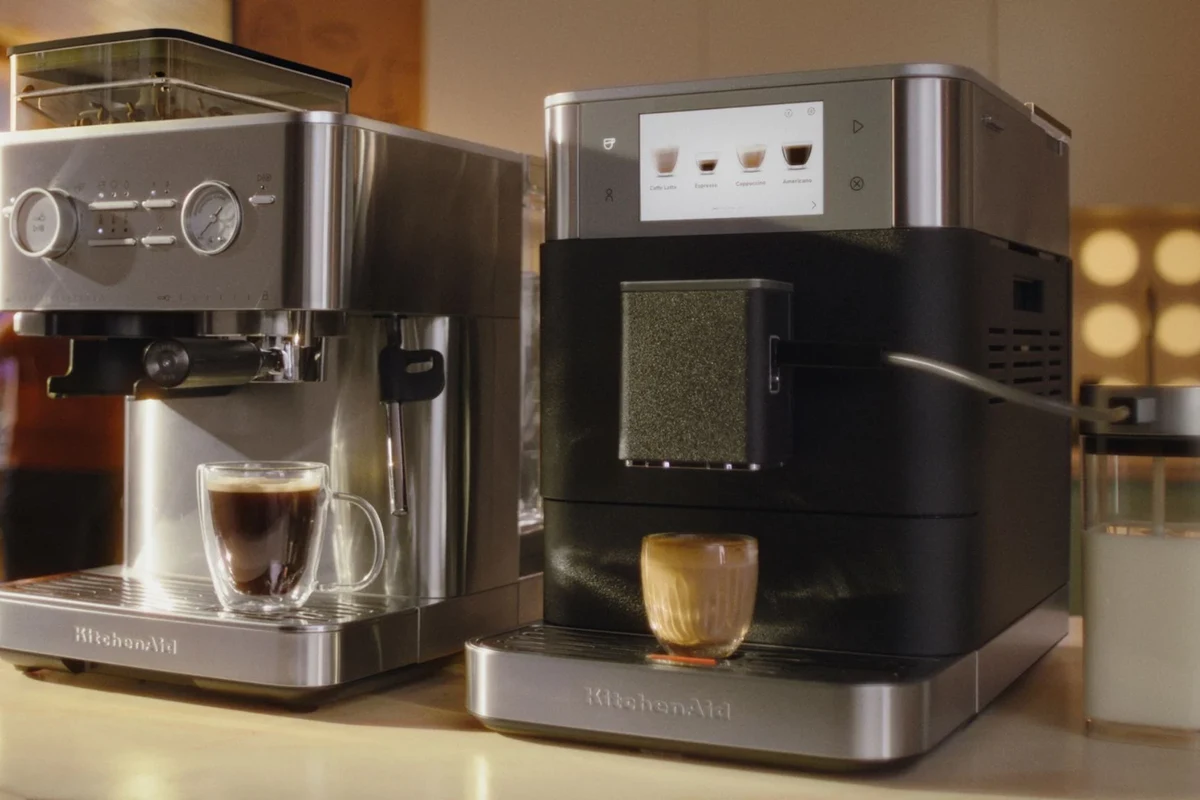 Older man choosing a smooth cup of coffee beside a kitchen counter with beans and a mug