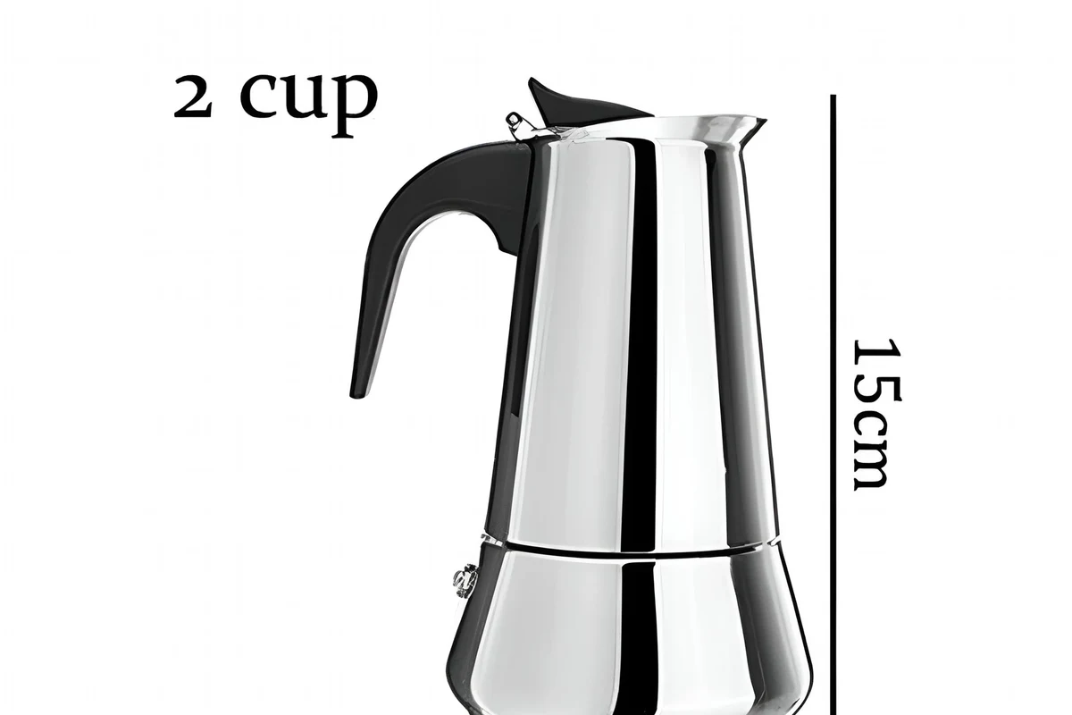Cold brew coffee maker with glass pitcher, filter basket, and coffee grounds in a home kitchen