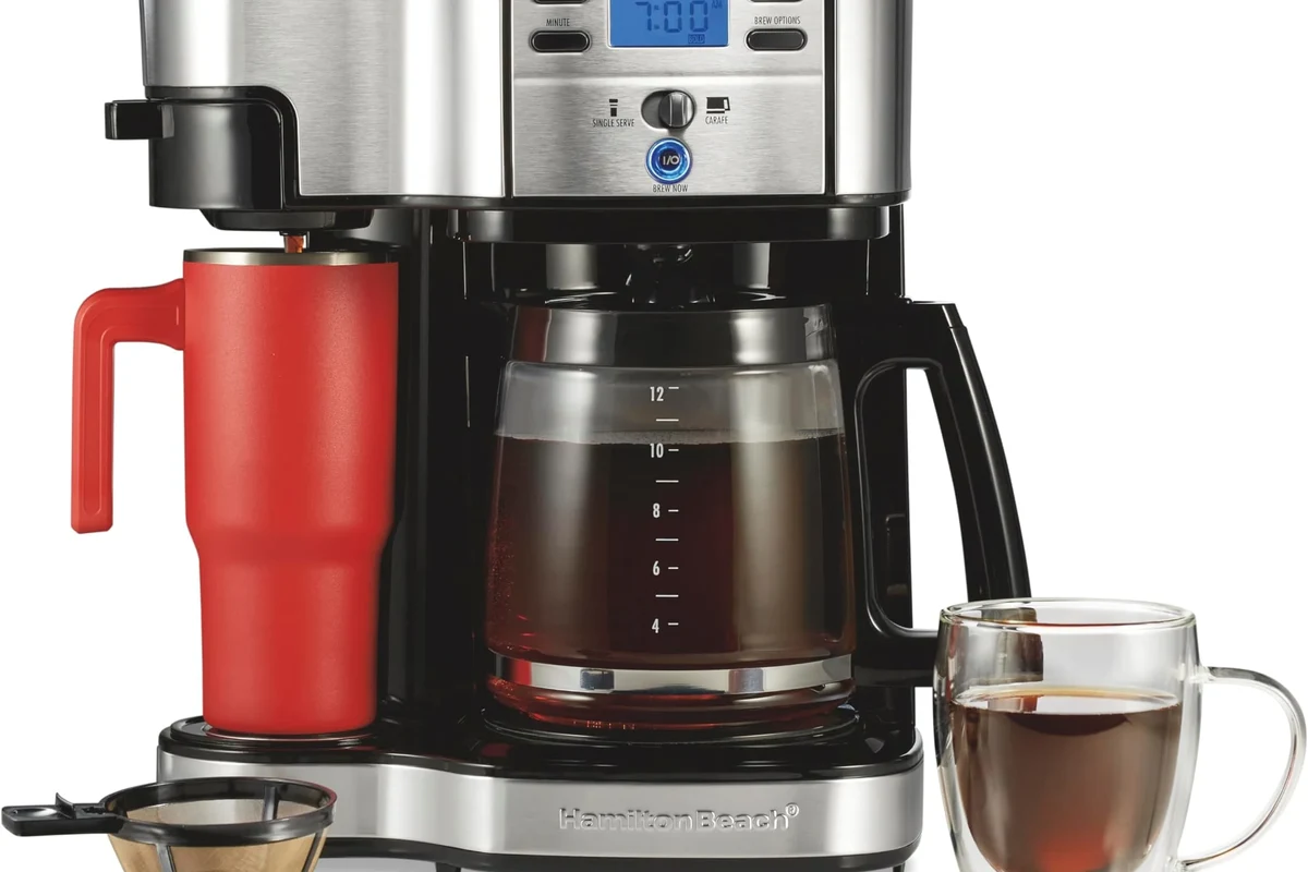 French press coffee brewing on a kitchen counter with grounds, hot water, and a glass press