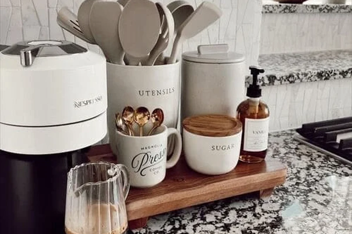 Cold brew coffee maker with glass jar, mesh filter, and brewed coffee on a kitchen counter