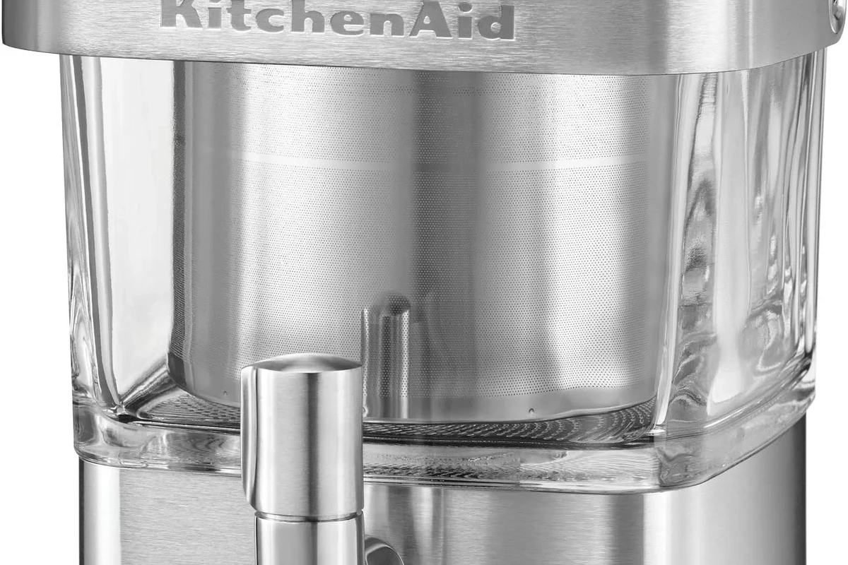 French press coffee maker being cleaned with warm water, soap, and a soft brush