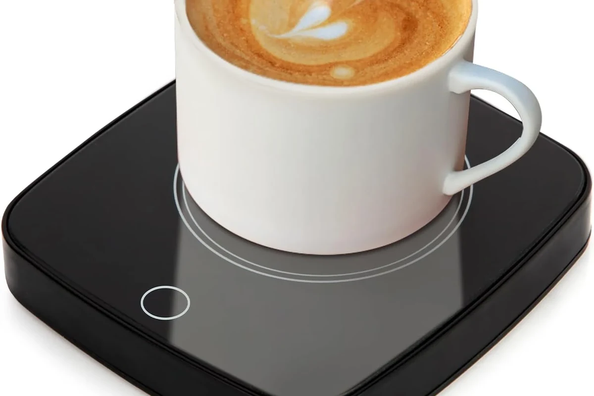 Coffee mug warmer heating a ceramic mug on a kitchen counter