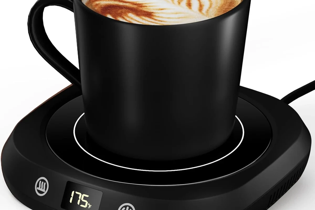 Coffee mug warmer heating a ceramic mug on a kitchen counter