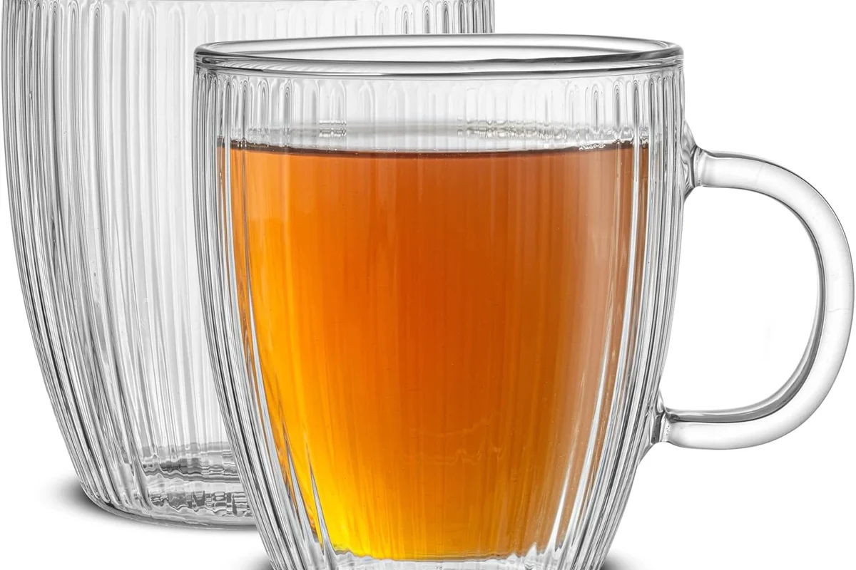 Vintage and modern coffee mugs arranged to show how mug design changed over time