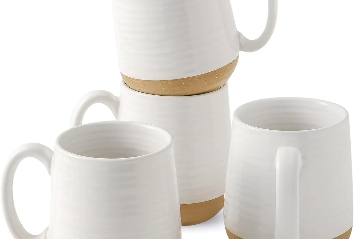Vintage and modern coffee mugs arranged to show how mug design changed over time