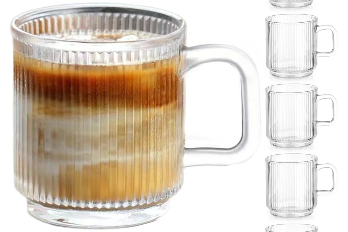 Clear glass coffee mugs with hot coffee on a kitchen counter