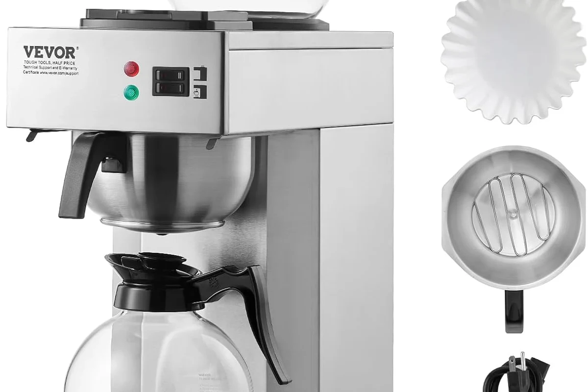 French press coffee maker with coarse grounds and hot coffee in a kitchen setting