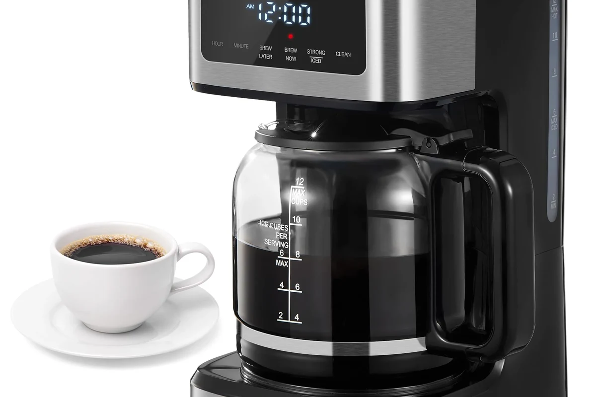 French press coffee steeping on a kitchen counter before pressing the plunger