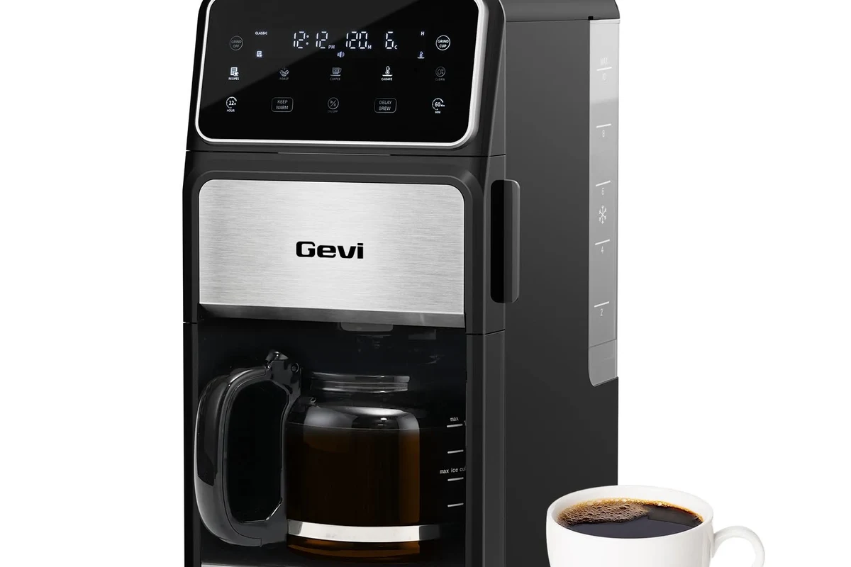 French press coffee maker with grounds, hot water, and a kitchen counter setup