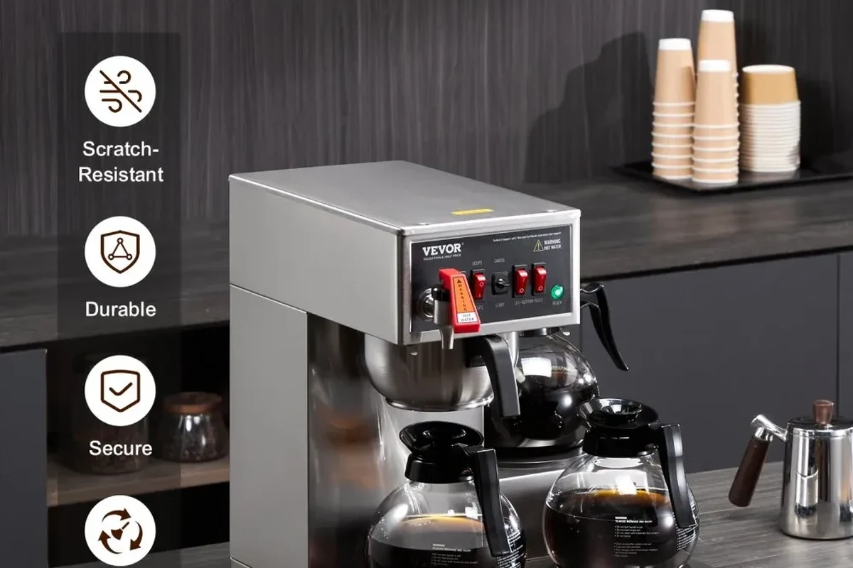 French press coffee maker being cleaned with warm water, soap, and a soft brush in a kitchen sink