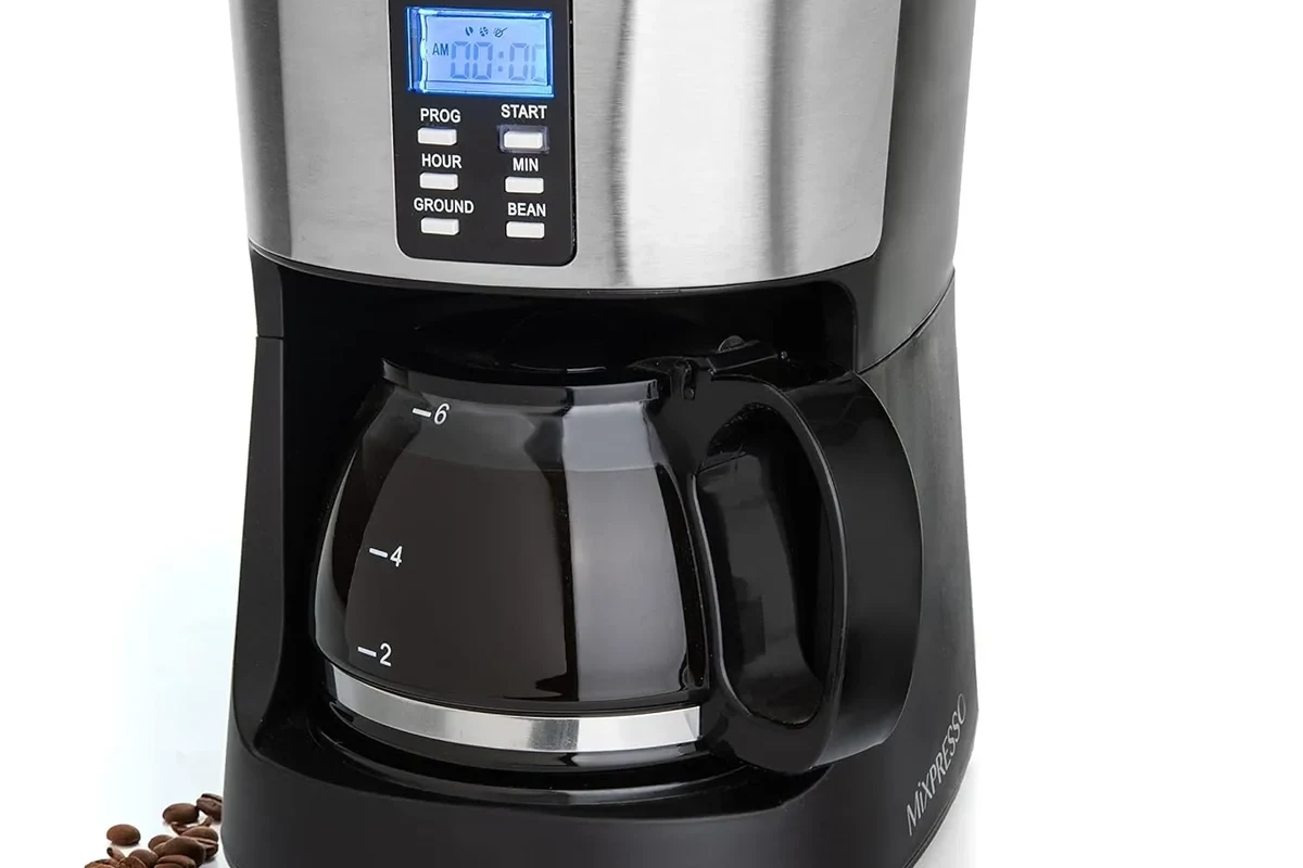 French press coffee steeping beside a timer and kettle in a bright kitchen