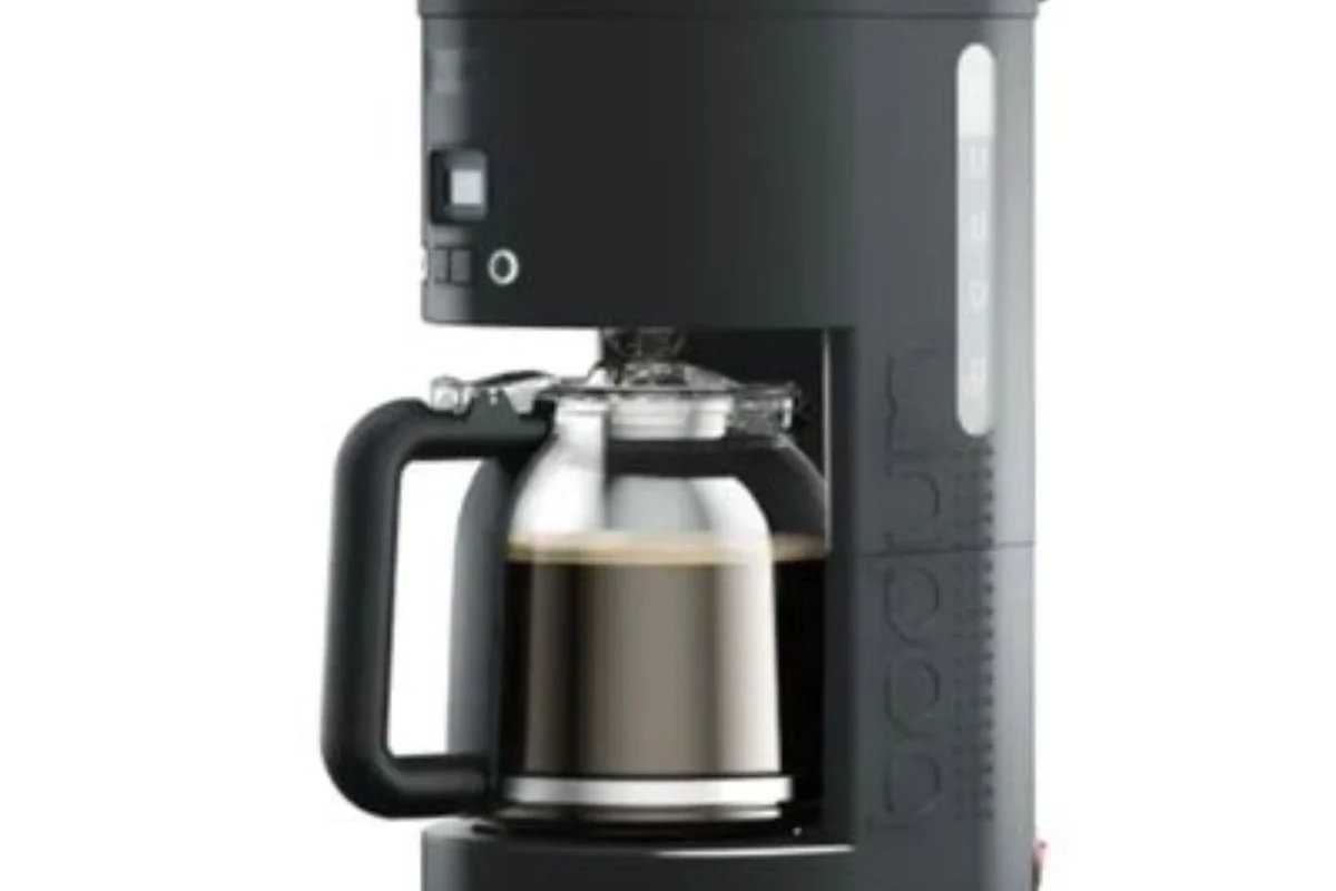 French press coffee steeping on a kitchen counter before pressing the plunger