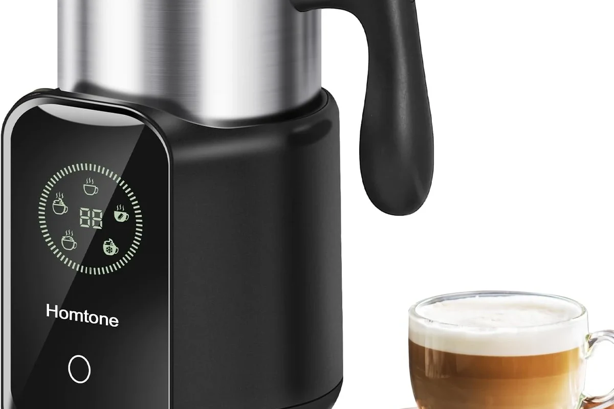 Electric milk frother heating and frothing milk in a home kitchen