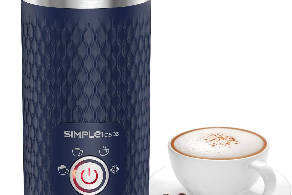 Electric milk frother heating and frothing milk in a home kitchen