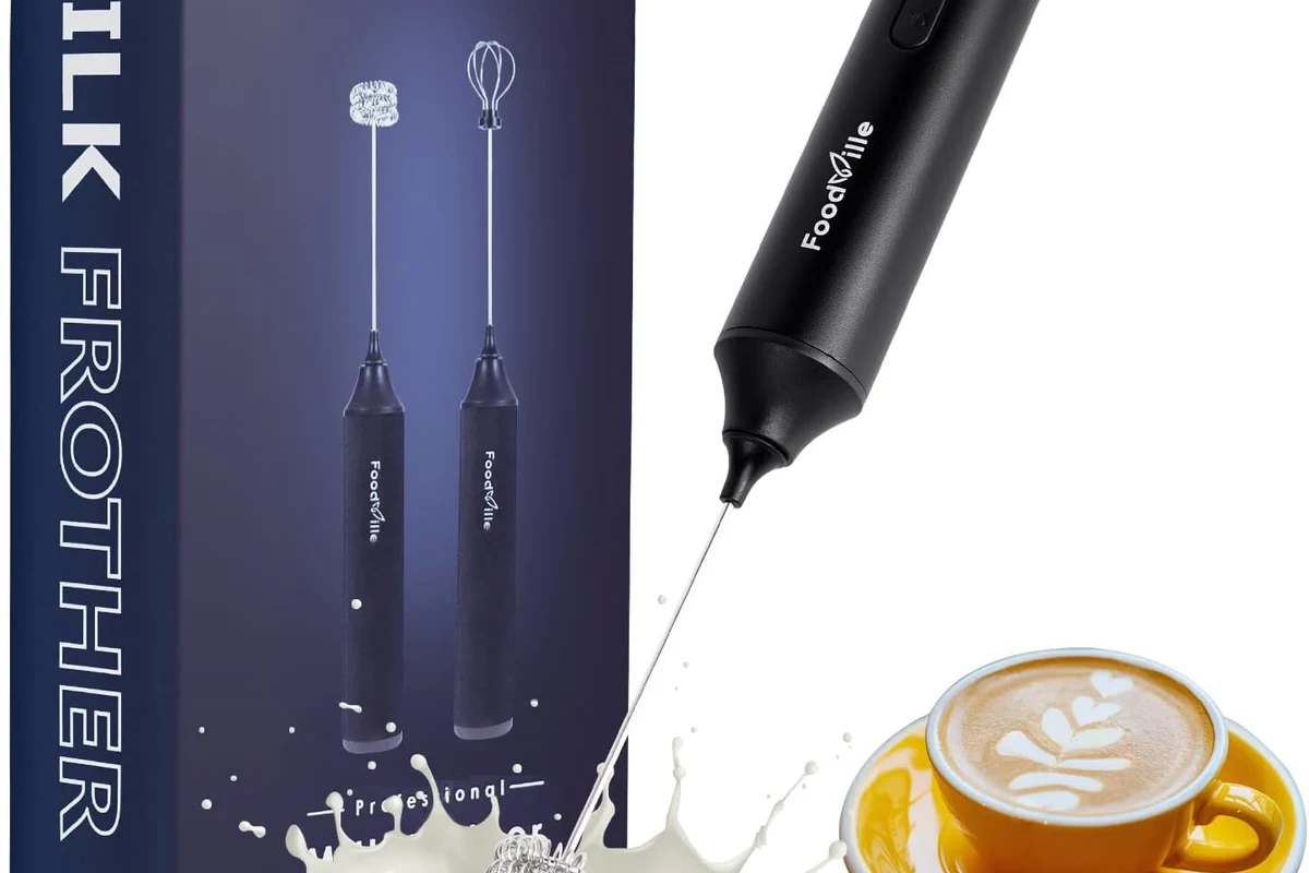 Electric milk frother making smooth matcha foam in a small kitchen cup