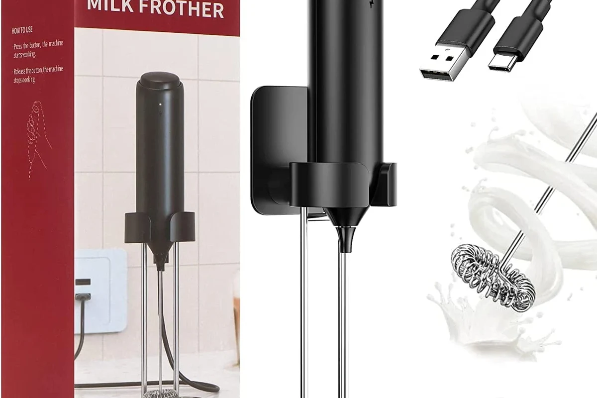 Electric milk frother beside a latte and cappuccino on a home kitchen counter
