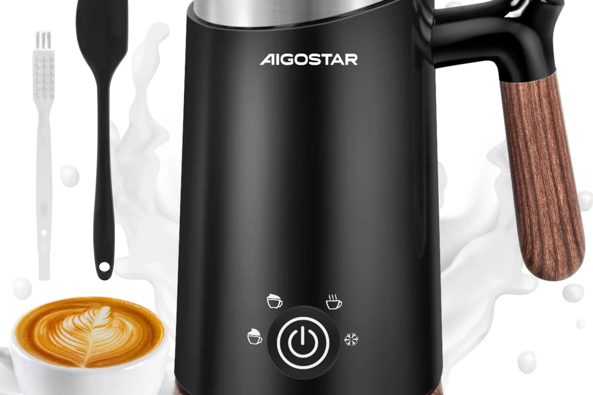 Electric milk frother heating and frothing milk in a kitchen mug
