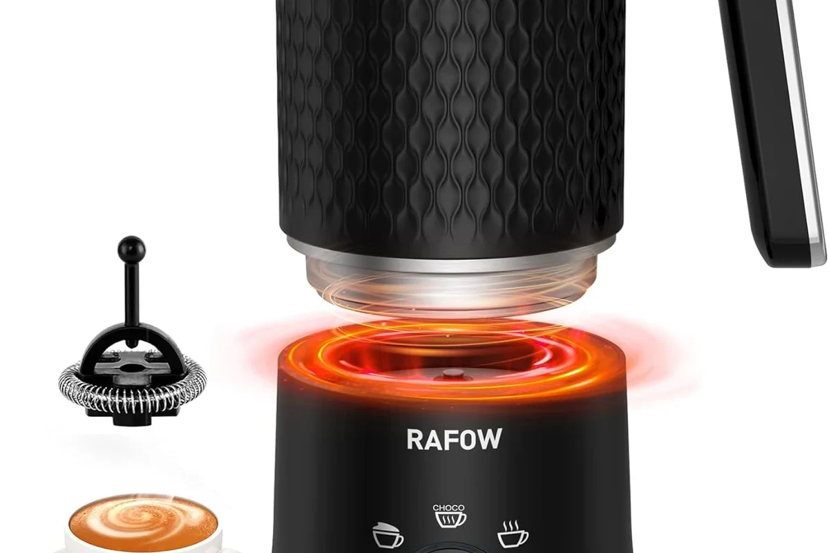 Electric milk frother whisking milk into foam in a home kitchen