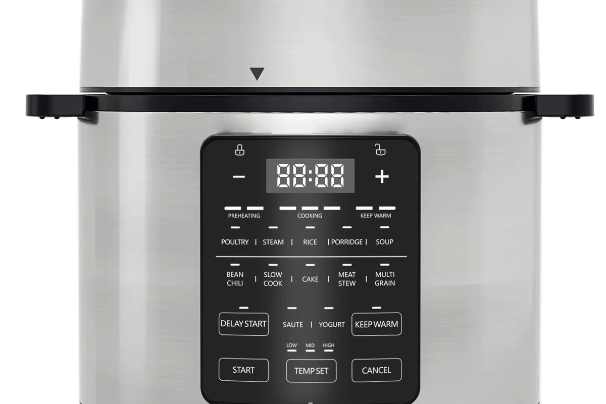 Instant Pot pasta with sauce in a stainless steel insert on a clean kitchen counter