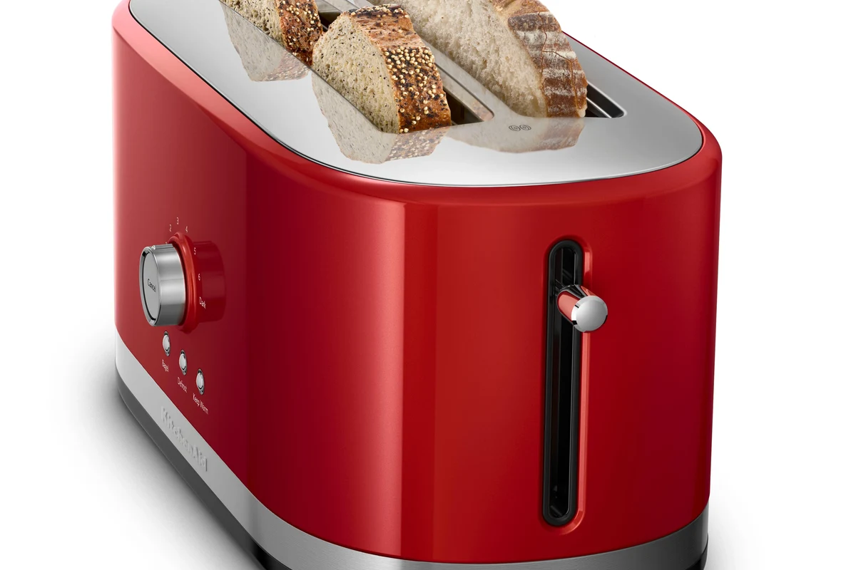 Air fryer basket with golden toast slices on a kitchen counter