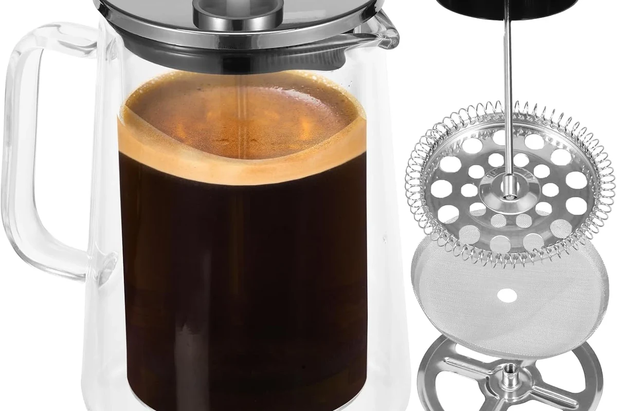 Beginner using a French press coffee maker with hot water, coarse grounds, and a kitchen counter