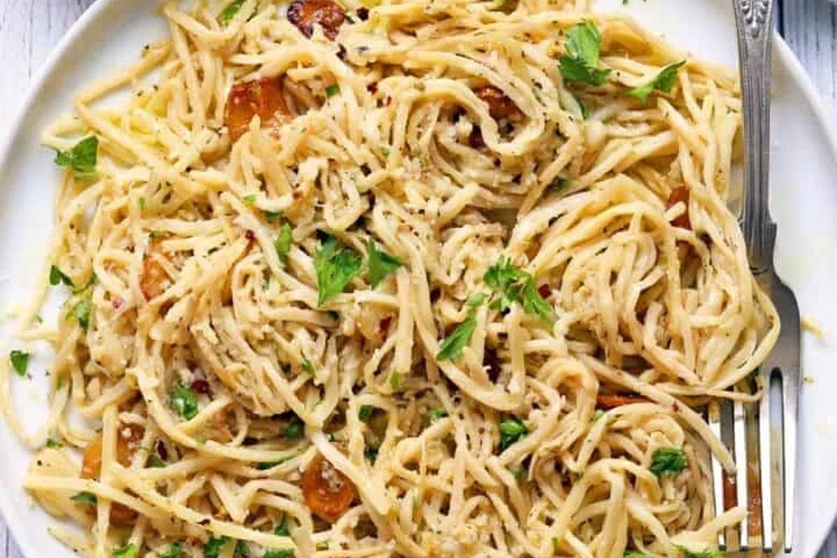 Hearts of palm pasta served with tomato sauce and herbs in a kitchen bowl
