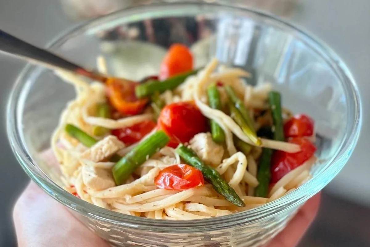 Hearts of palm pasta served with tomato sauce and herbs in a kitchen bowl