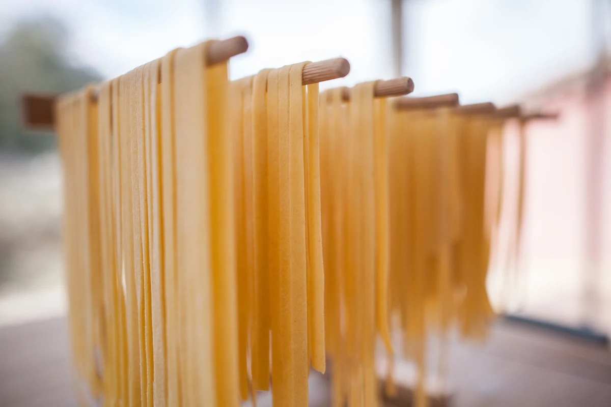 Homemade dried pasta stored in an airtight jar on a kitchen shelf