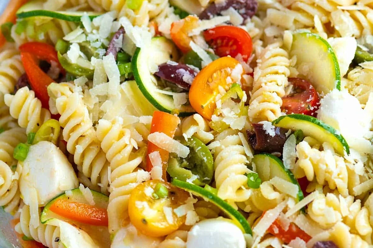 Healthy pasta salad with whole wheat pasta, fresh vegetables, and light vinaigrette in a bowl
