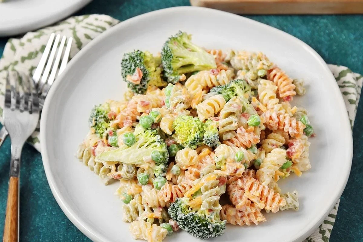Healthy pasta salad with whole wheat pasta, fresh vegetables, and light vinaigrette in a bowl