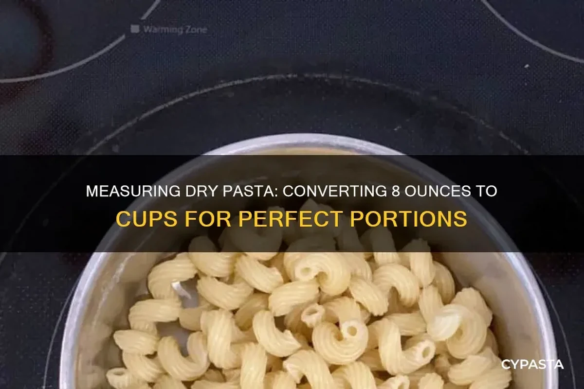 Dry pasta in a measuring cup beside a kitchen scale on a clean countertop