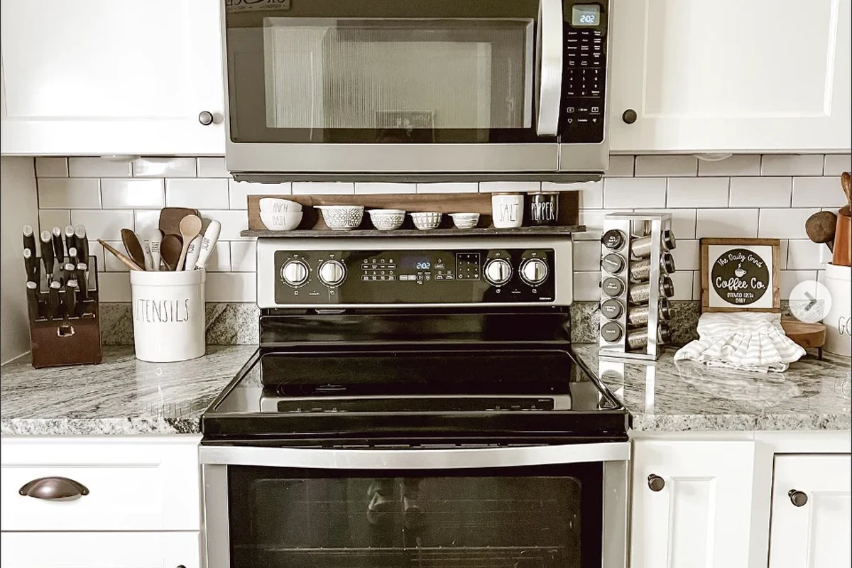 Coffee mug heating in a microwave with steam rising from the drink