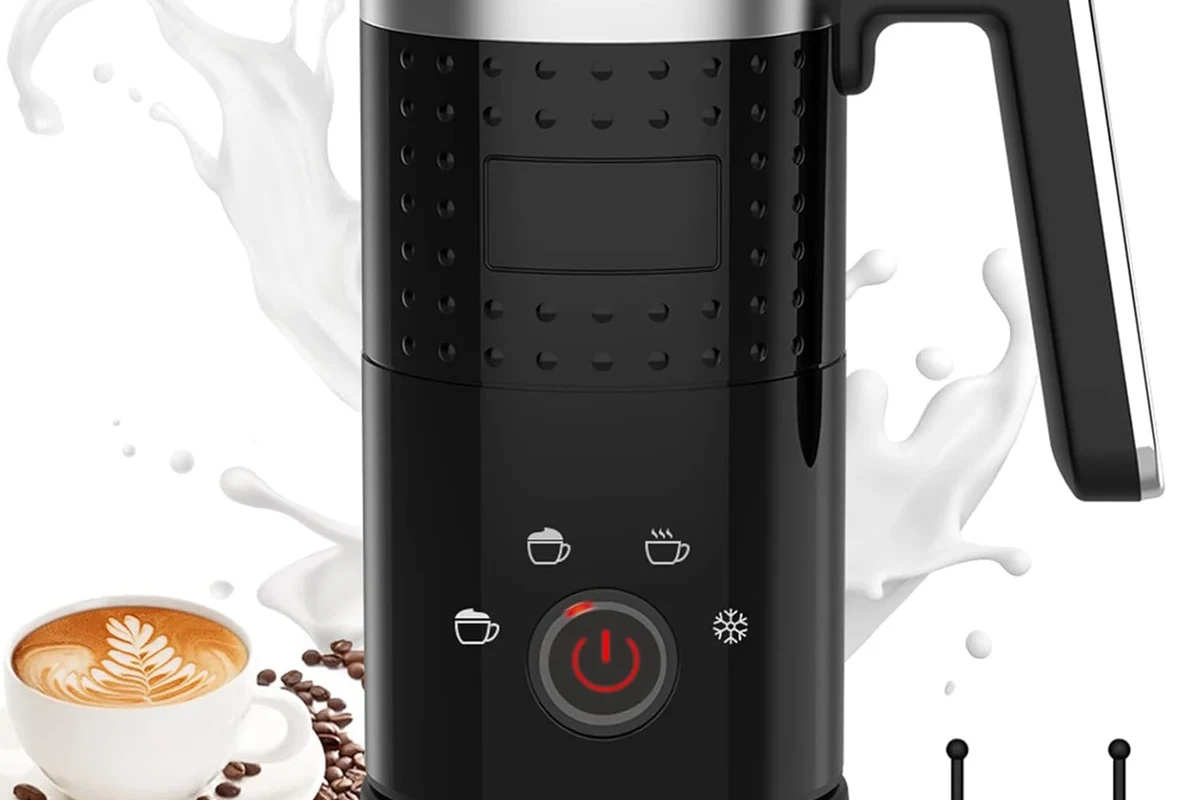 Milk frother heating and foaming milk in a kitchen countertop pitcher