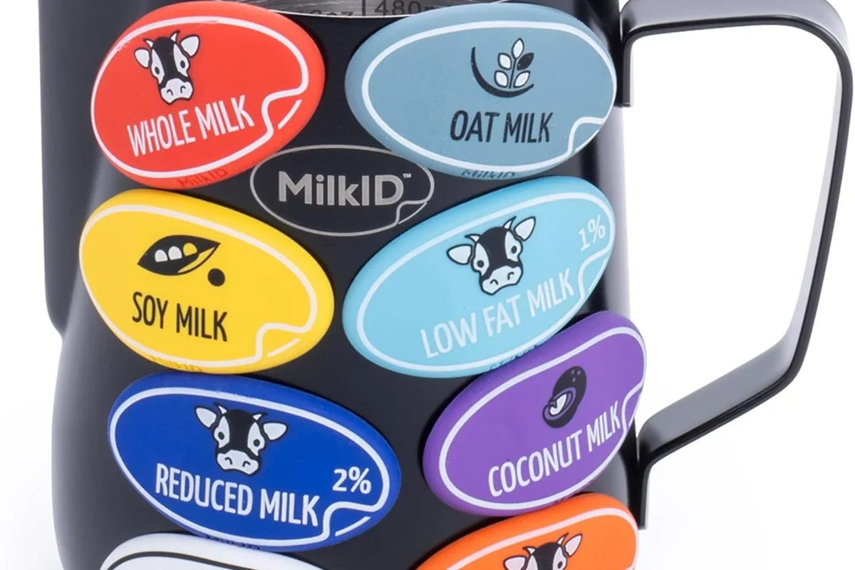 Electric milk frother making creamy foam for a home coffee drink