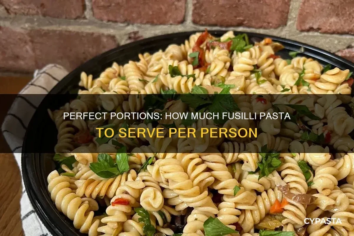Bowl of cooked pasta with measured dry pasta portions and serving tools on a kitchen counter