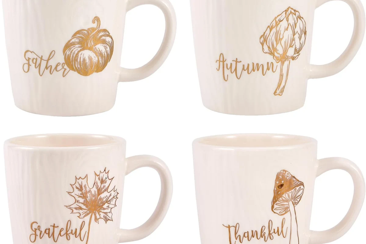 Assorted coffee mugs on a kitchen shelf, including ceramic, glass, and travel mugs