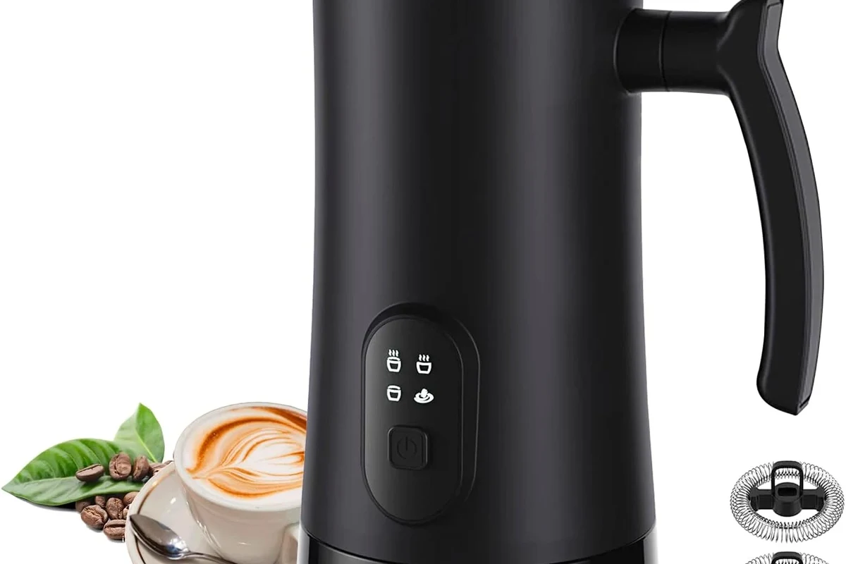 Electric milk frother with removable lid and whisk on a clean kitchen counter