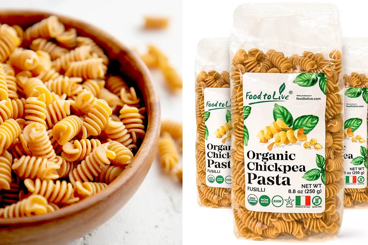 Organic pasta, whole wheat pasta, and fresh vegetables arranged in a bright home kitchen