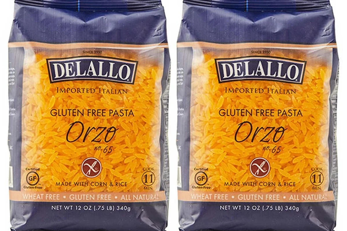 Bowl of orzo pasta with a side note about gluten free options in a home kitchen