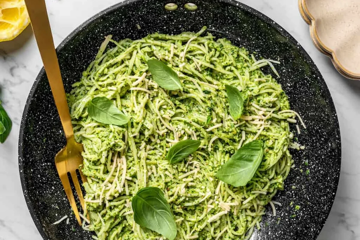 Bowl of pasta with vegetables and whole wheat noodles on a kitchen table