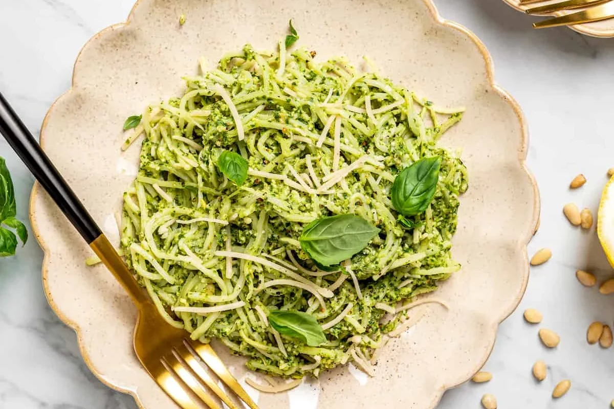 Bowl of pasta with vegetables and lean protein on a kitchen table