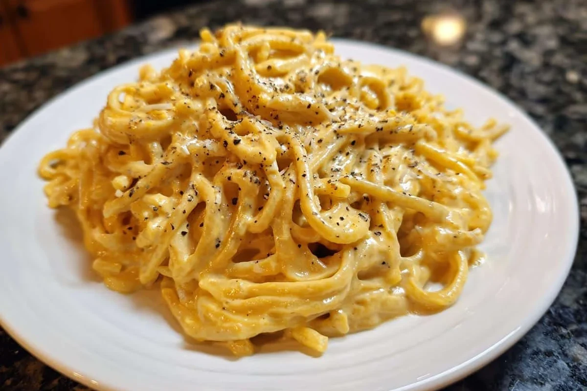 Plain pasta, fresh pasta, and filled ravioli on a kitchen counter with ingredient labels nearby